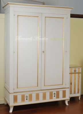 Classic wooden cabinet with white lacquered finish and hand-applied gold leaf